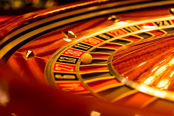 Slot game lobby showing new release tags, paytable preview, and bonus feature animations